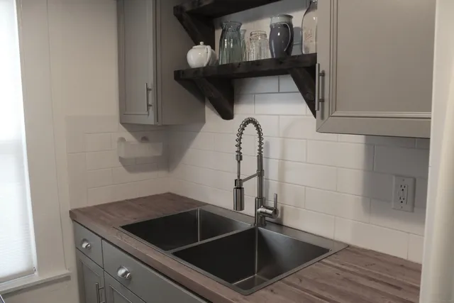 a bathroom with a sink and mirror