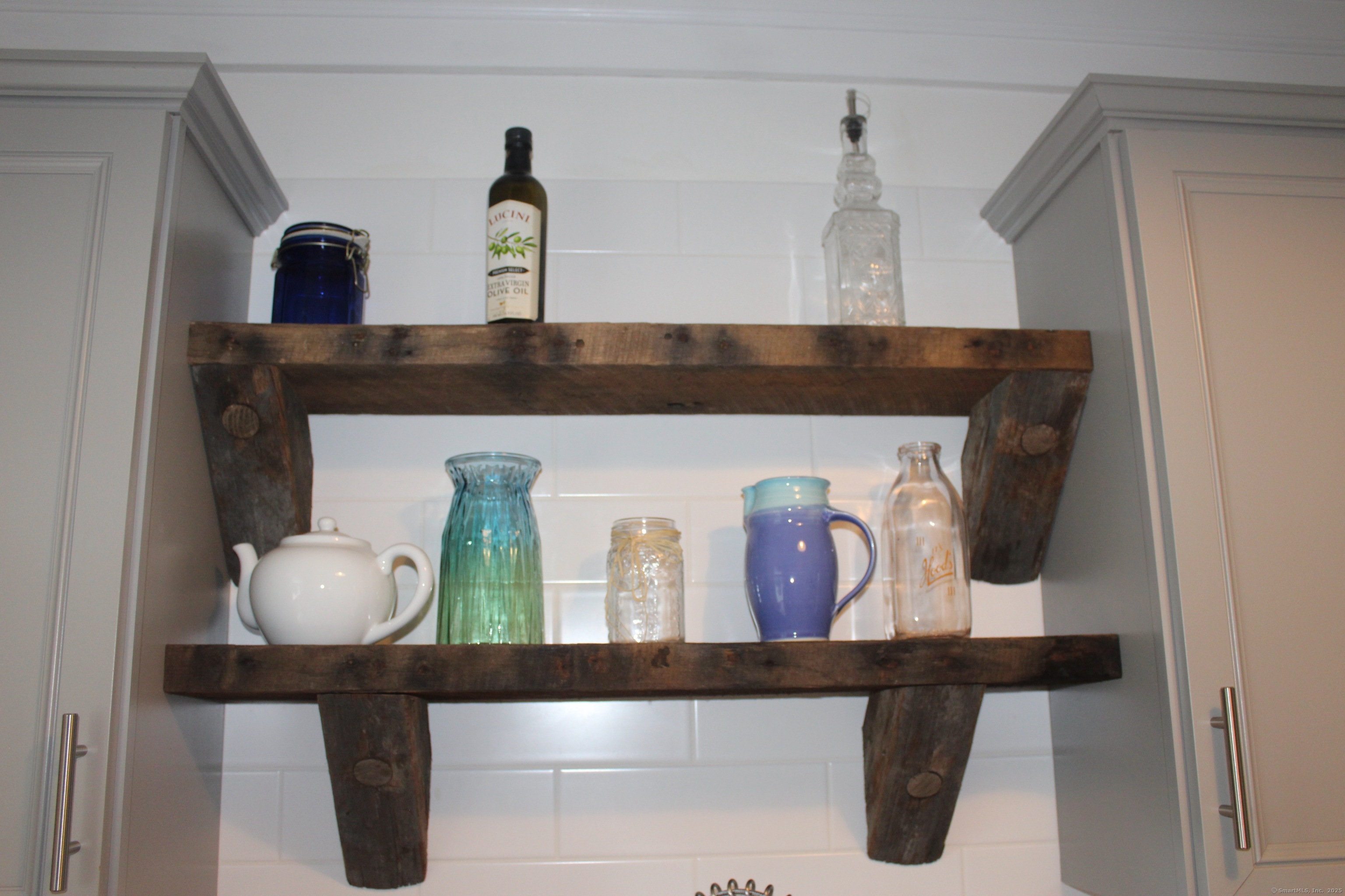 6 West Main Street Chester, CT 06412 - Photo 26 of 37 a bathroom with a sink and a mirror