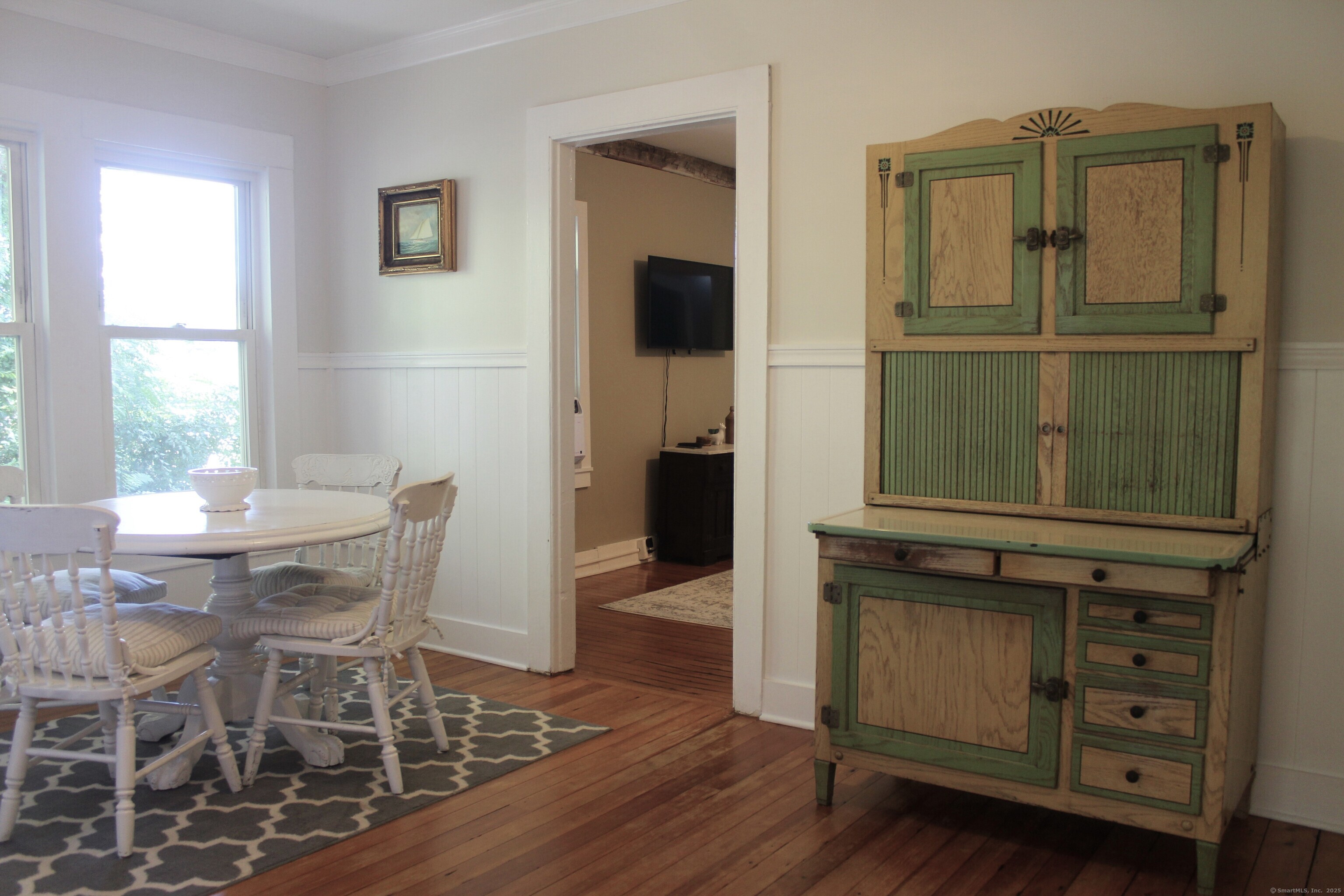 6 West Main Street Chester, CT 06412 - Photo 27 of 37 a view of a dining room with furniture and a window