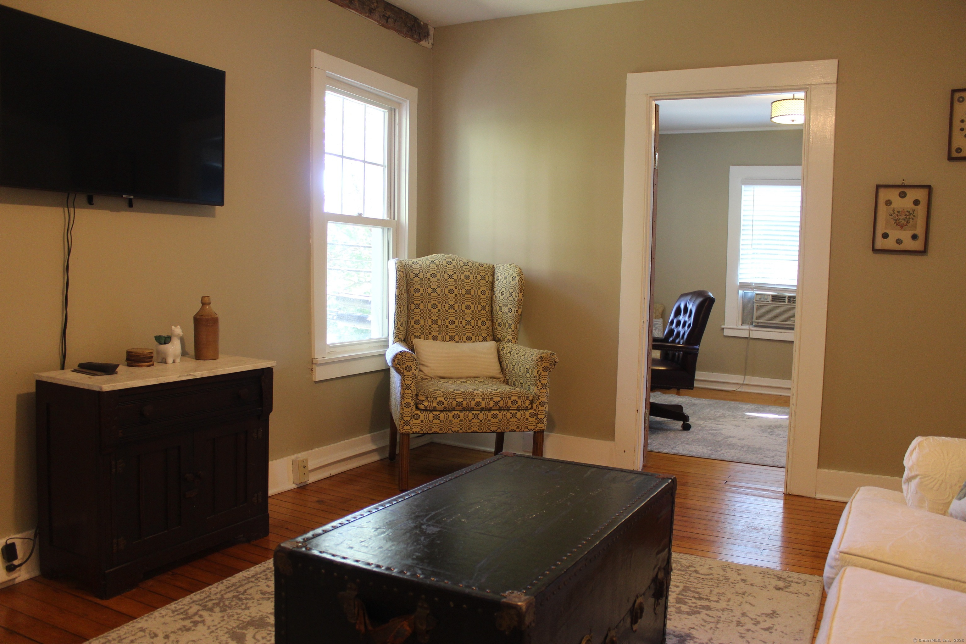 6 West Main Street Chester, CT 06412 - Photo 29 of 37 a living room with furniture and a flat screen tv