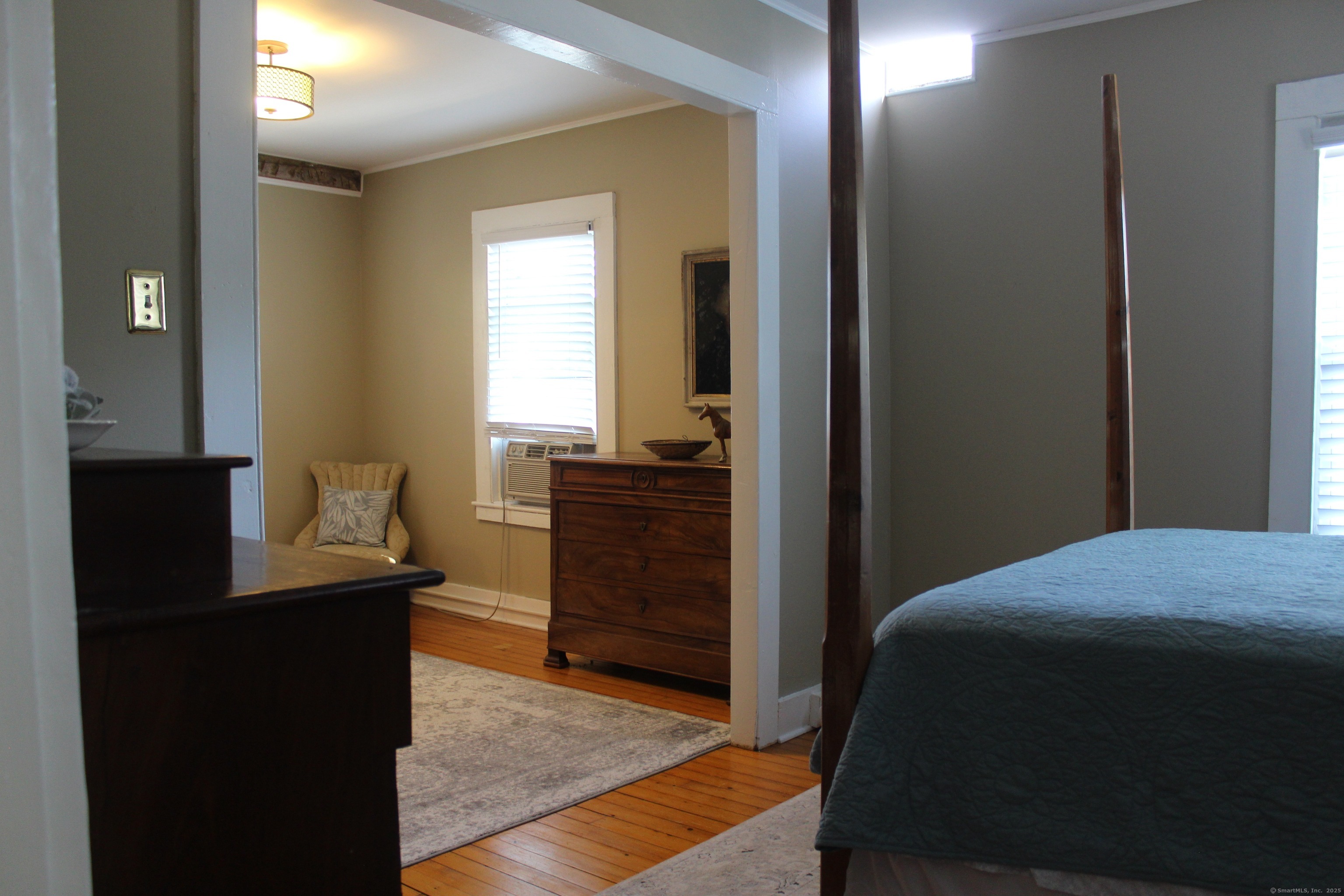 6 West Main Street Chester, CT 06412 - Photo 31 of 37 a bedroom with a bed and a dresser