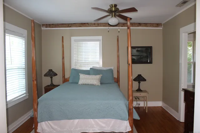 a bedroom with a bed and a dresser