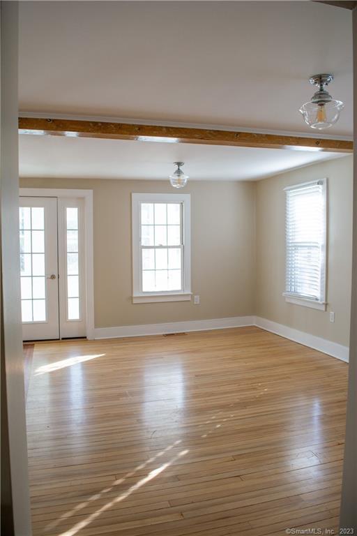 6 West Main Street Chester, CT 06412 - Photo 9 of 37 a view of an empty room with wooden floor and a window