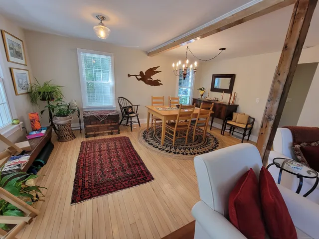 a very nice looking living room with a rug and a window