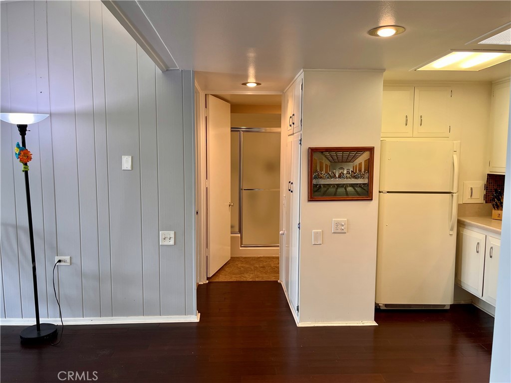 1842 Thunderbird Drive, Unit 1C Seal Beach, CA 90740 - Photo 15 of 16 a view of a hallway with wooden floor