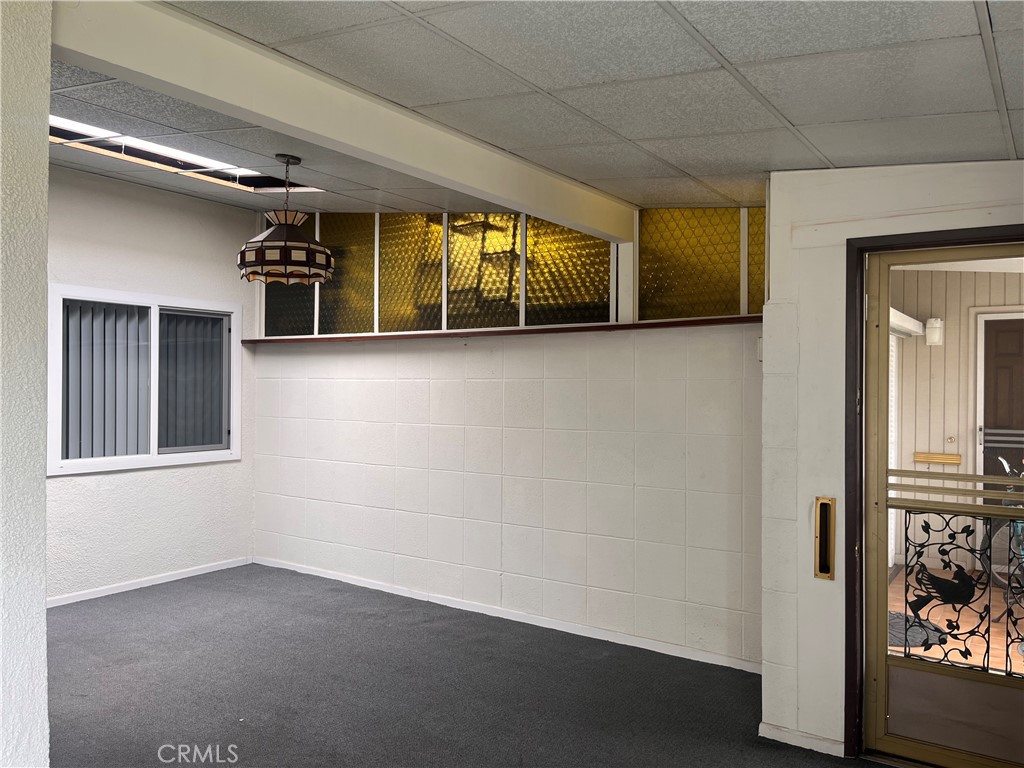 1842 Thunderbird Drive, Unit 1C Seal Beach, CA 90740 - Photo 5 of 16 a view of an empty room with a window