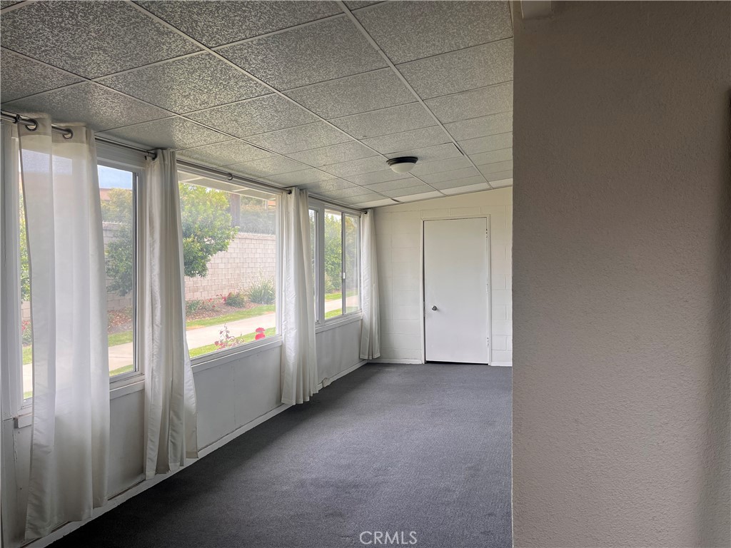 1842 Thunderbird Drive, Unit 1C Seal Beach, CA 90740 - Photo 6 of 16 a view of an empty room and a window