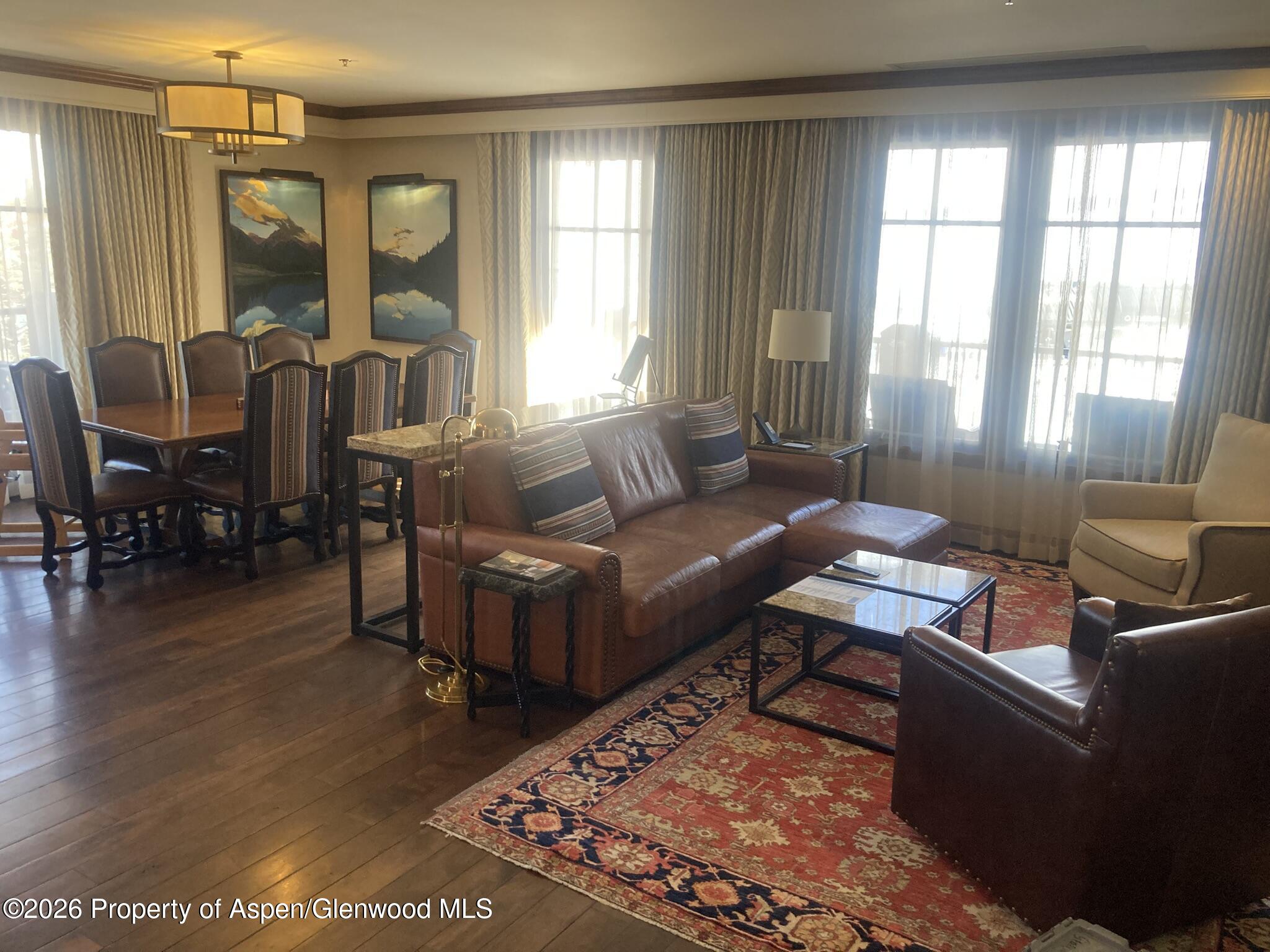39 Boomerang Road, Unit 841010 Aspen, CO 81611 - Photo 3 of 21 a living room with furniture and a large window