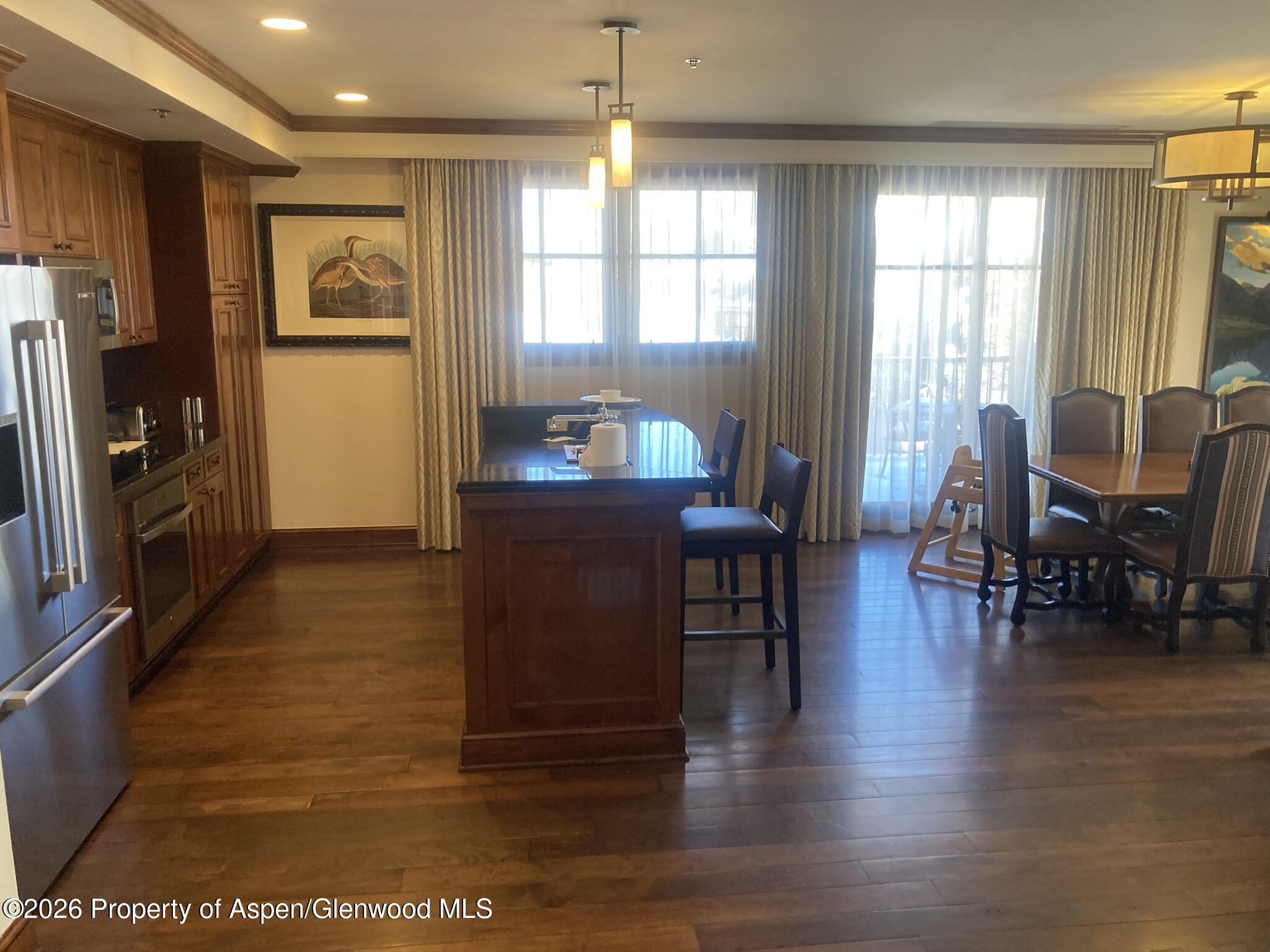 39 Boomerang Road, Unit 841010 Aspen, CO 81611 - Photo 10 of 21 a living room with furniture window and wooden floor
