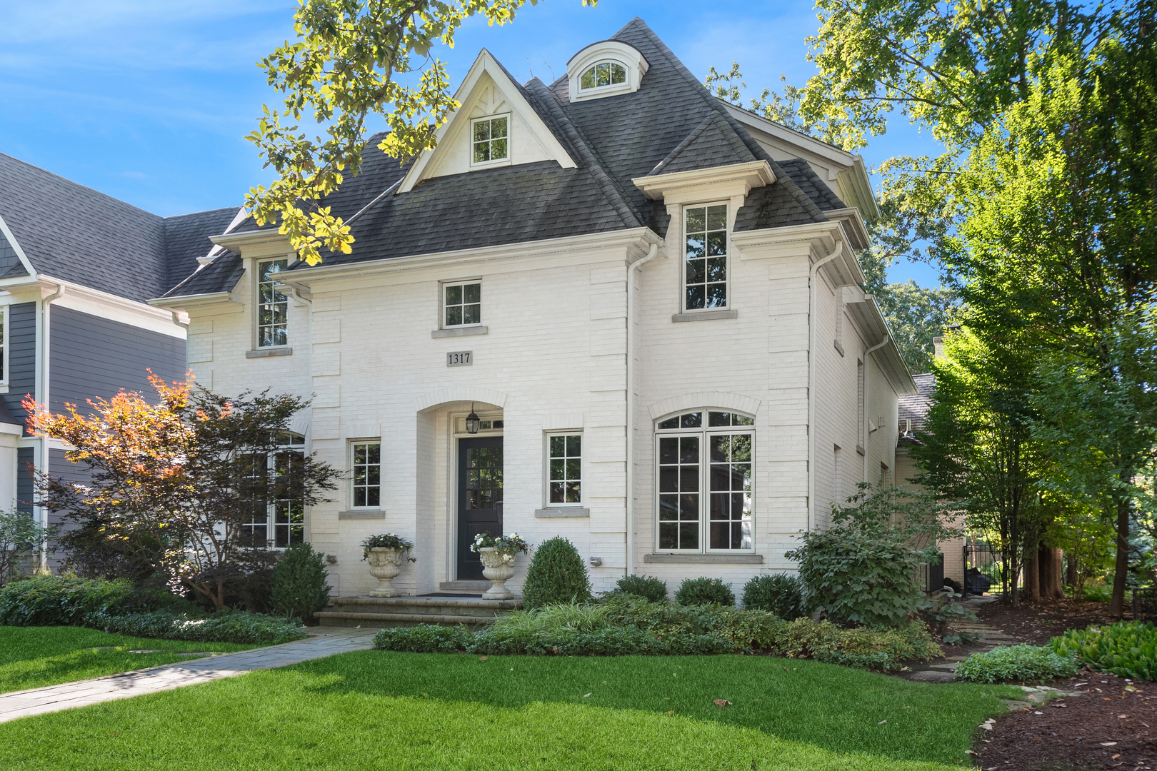 1317 Maple Avenue Wilmette, IL 60091 - Photo 2 of 15 front view of a house with a yard