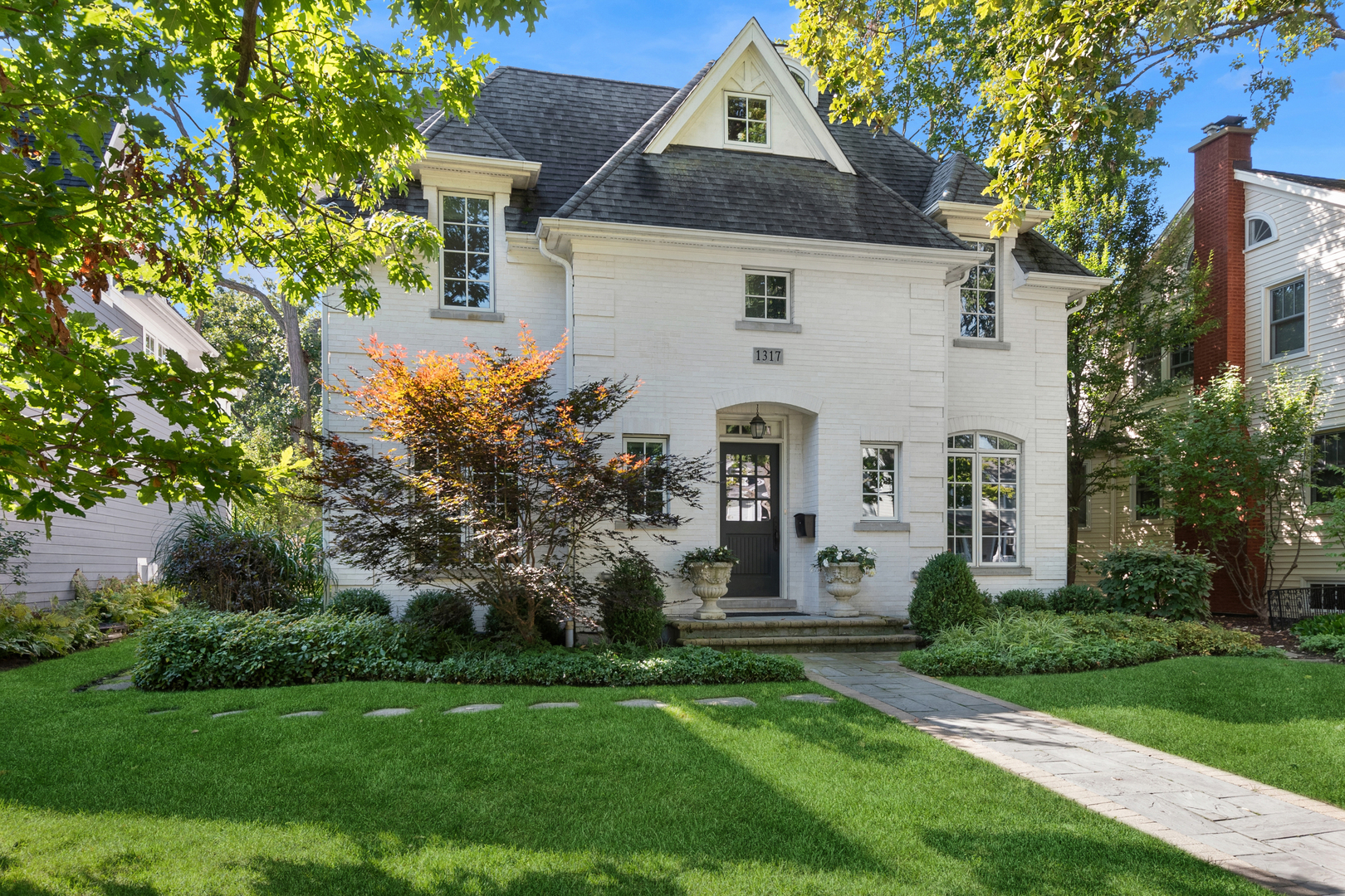 1317 Maple Avenue Wilmette, IL 60091 - Photo 4 of 15 front view of a house with a garden