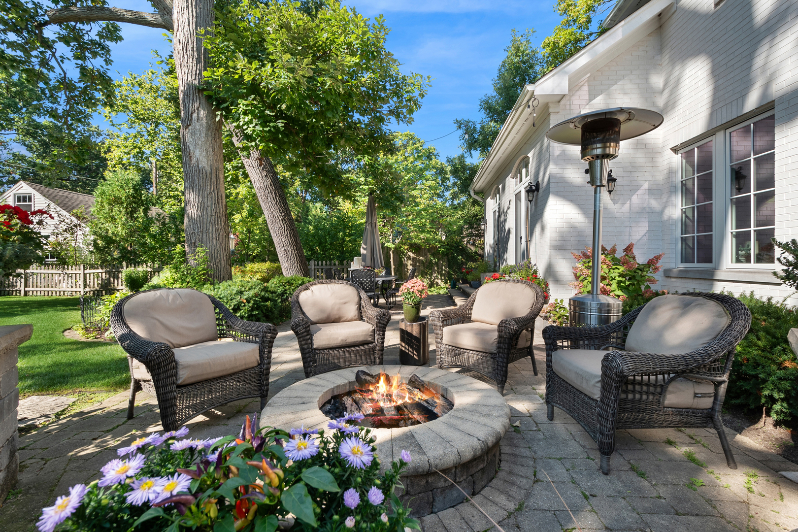 1317 Maple Avenue Wilmette, IL 60091 - Photo 6 of 15 a backyard of a house with yard fountain and outdoor seating