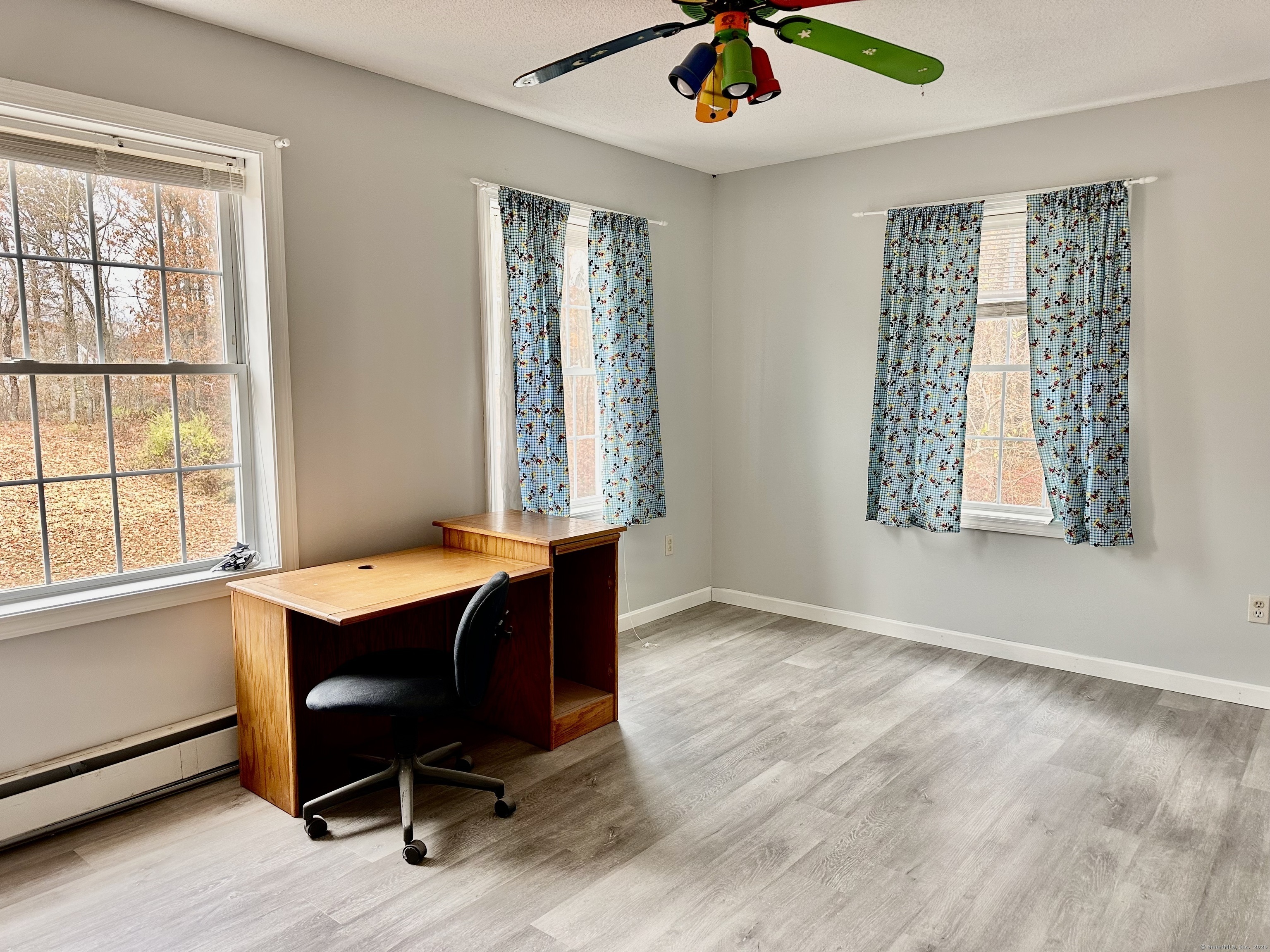 288 Leonard Bridge Road Lebanon, CT 06249 - Photo 11 of 14 a workspace with wooden floor and windows