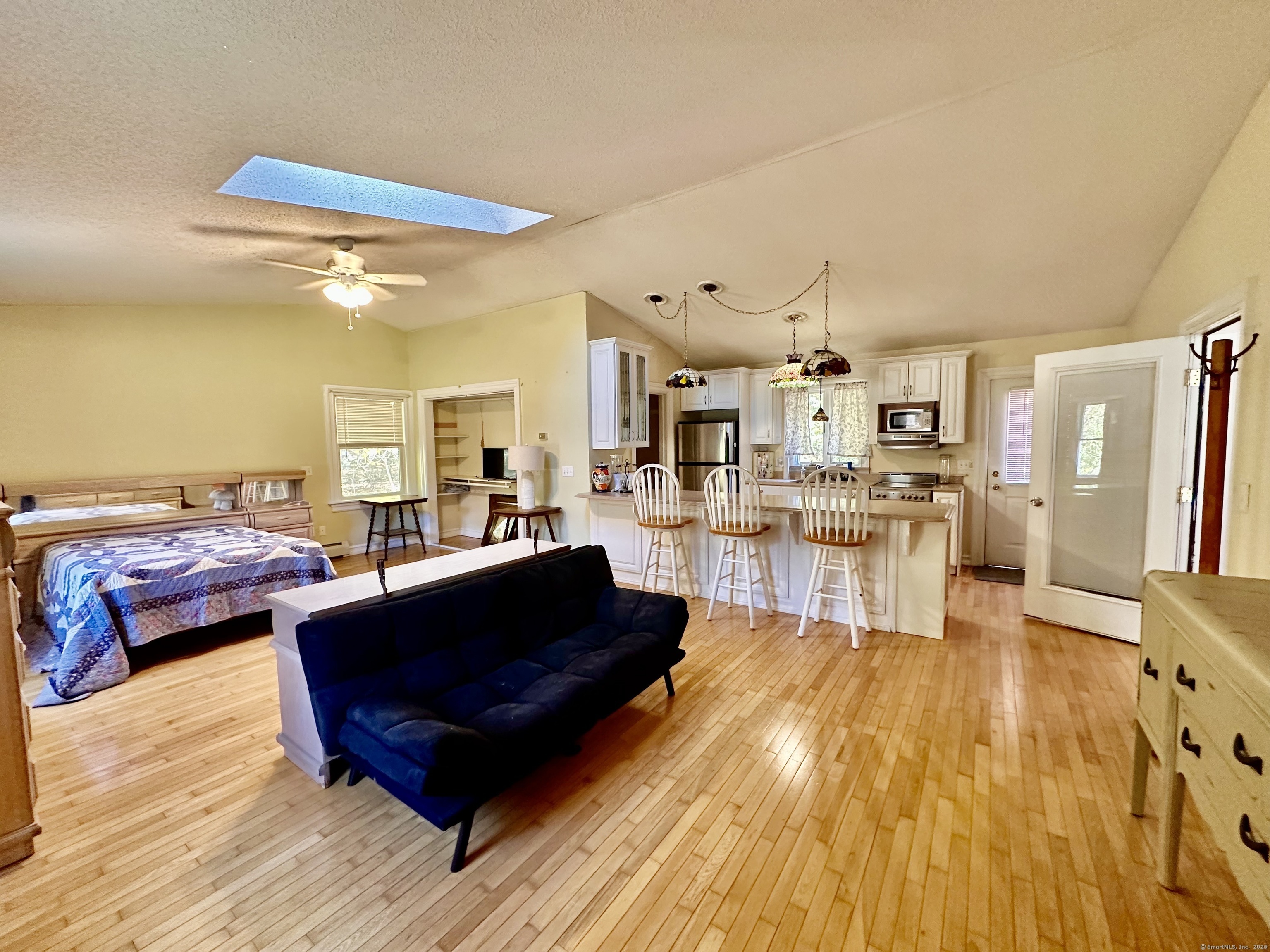288 Leonard Bridge Road Lebanon, CT 06249 - Photo 12 of 14 a living room with furniture and a wooden floor