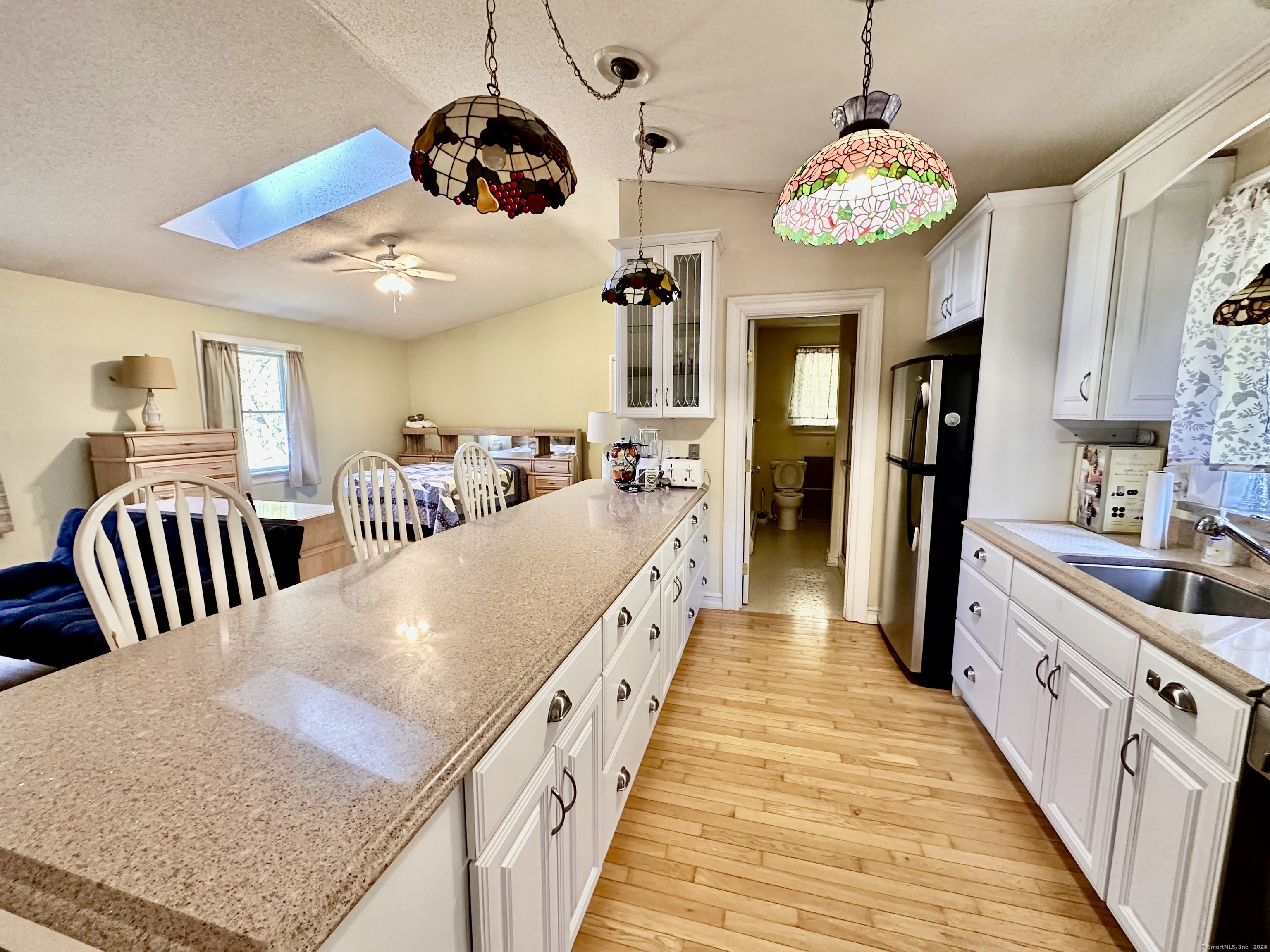288 Leonard Bridge Road Lebanon, CT 06249 - Photo 14 of 14 a view of a dining room and wooden floor
