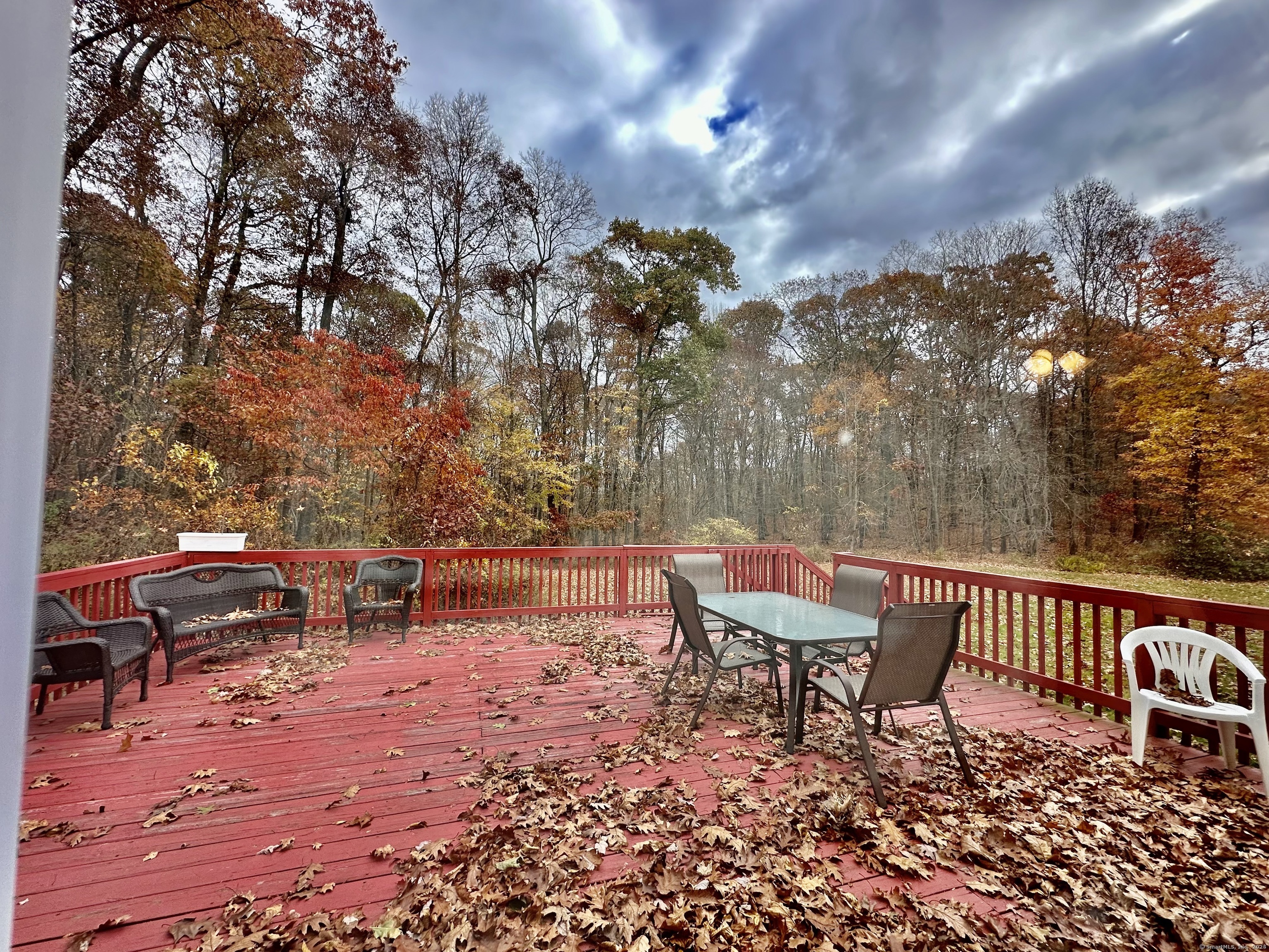 288 Leonard Bridge Road Lebanon, CT 06249 - Photo 6 of 14 a backyard of a house with table and chairs