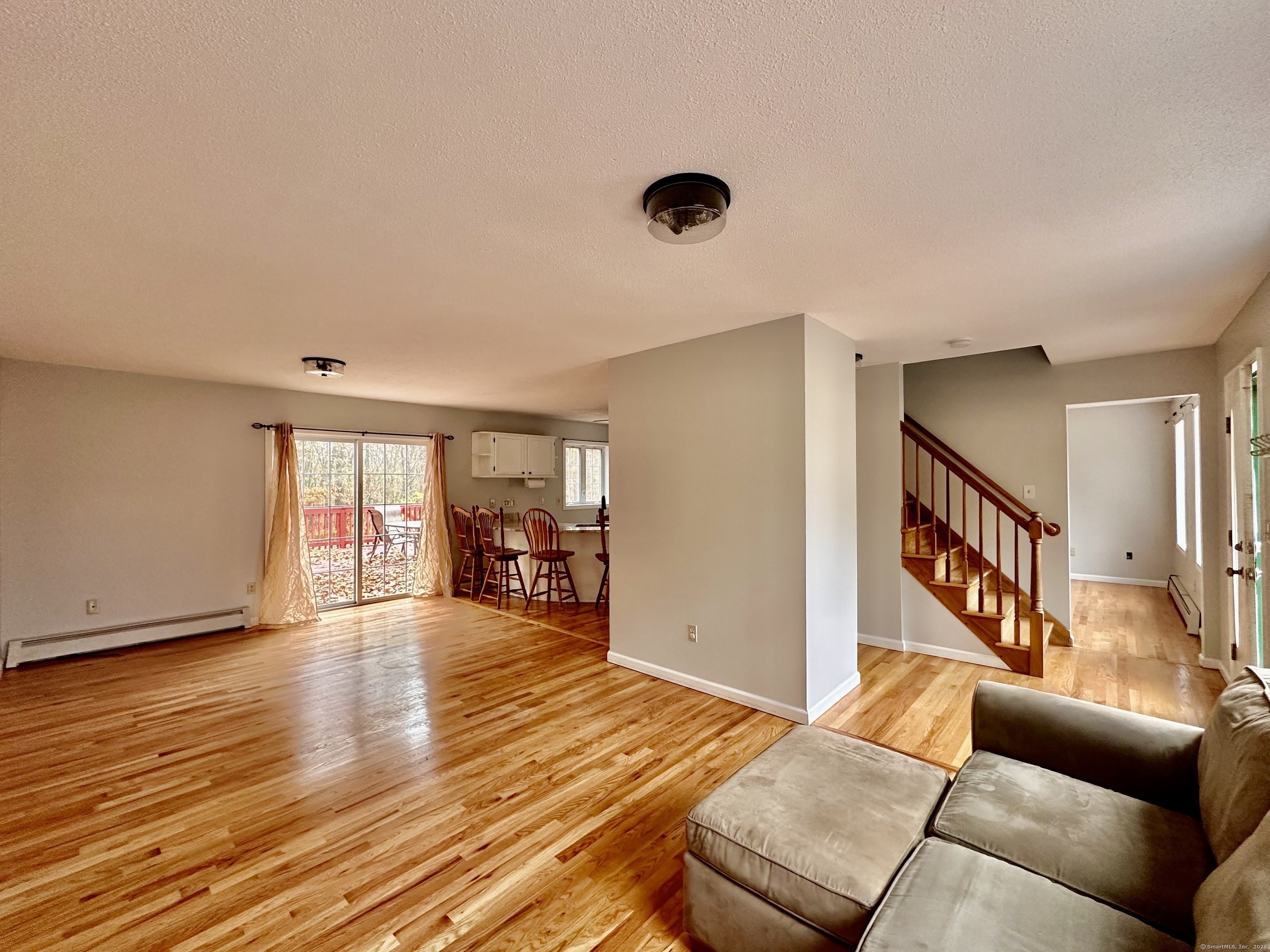 288 Leonard Bridge Road Lebanon, CT 06249 - Photo 7 of 14 a living room with furniture and a wooden floor