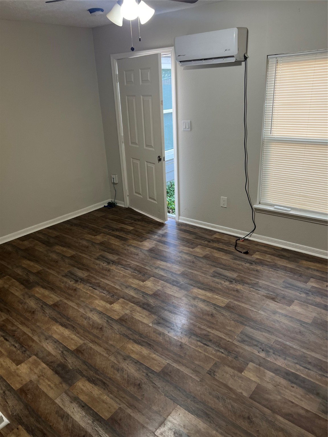 7909 Brutus Street, Unit 4 Houston, TX 77012 - Photo 9 of 9 a view of a room with wooden floor and a window