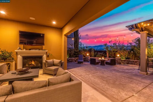 a view of a livingroom with furniture and a fireplace
