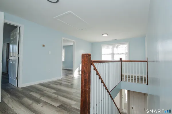a view of a hallway with staircase