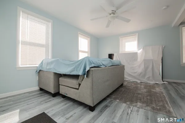 a living room with furniture and a window