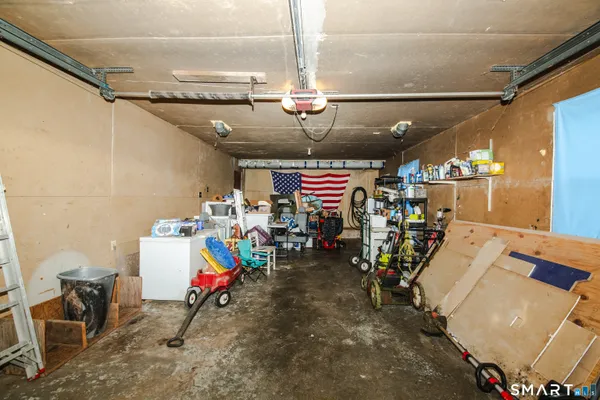 a view of a garage with rack and bicycle