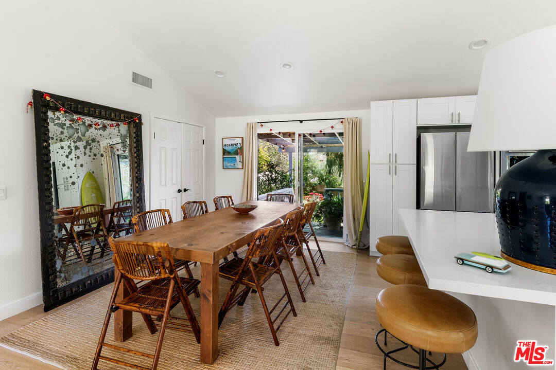 6551 Zumirez Drive Malibu, CA 90265 - Photo 12 of 36 a view of a dining room with furniture window and outside view
