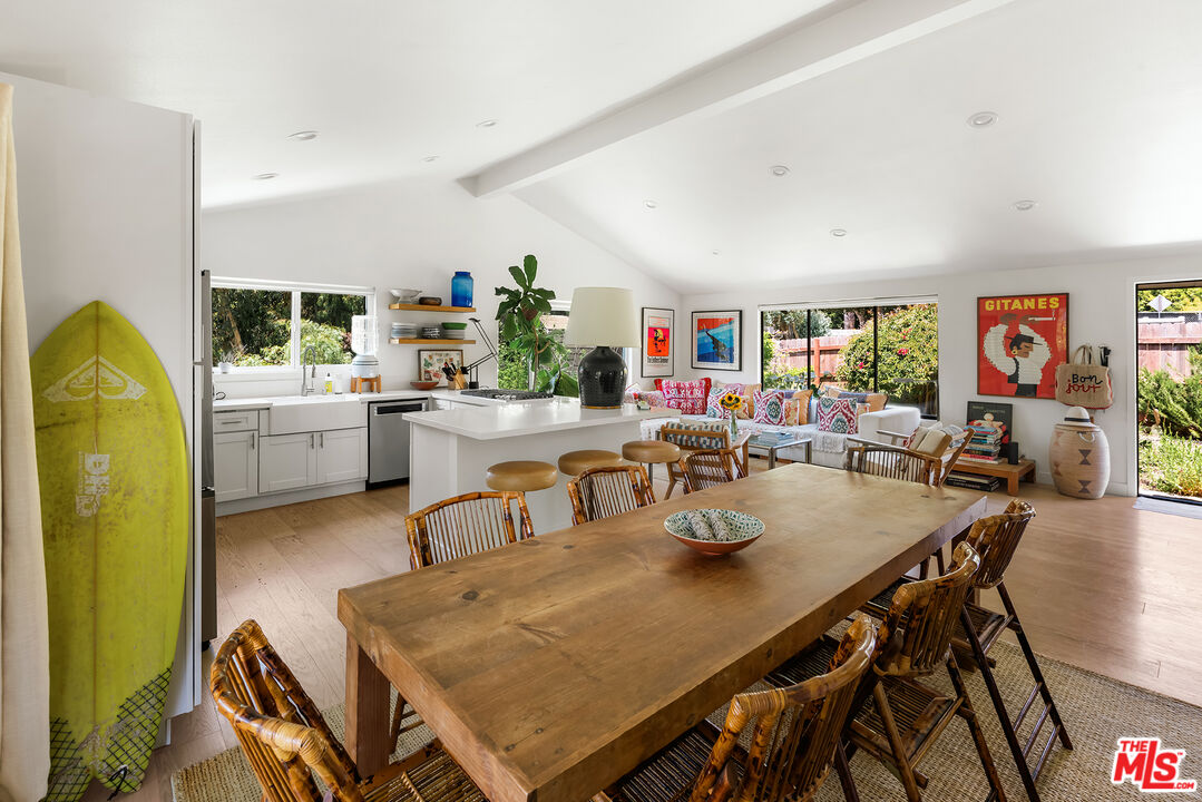6551 Zumirez Drive Malibu, CA 90265 - Photo 13 of 36 a view of a dining room with furniture and a window