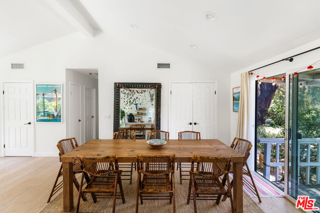 6551 Zumirez Drive Malibu, CA 90265 - Photo 14 of 36 a dining room with furniture and window