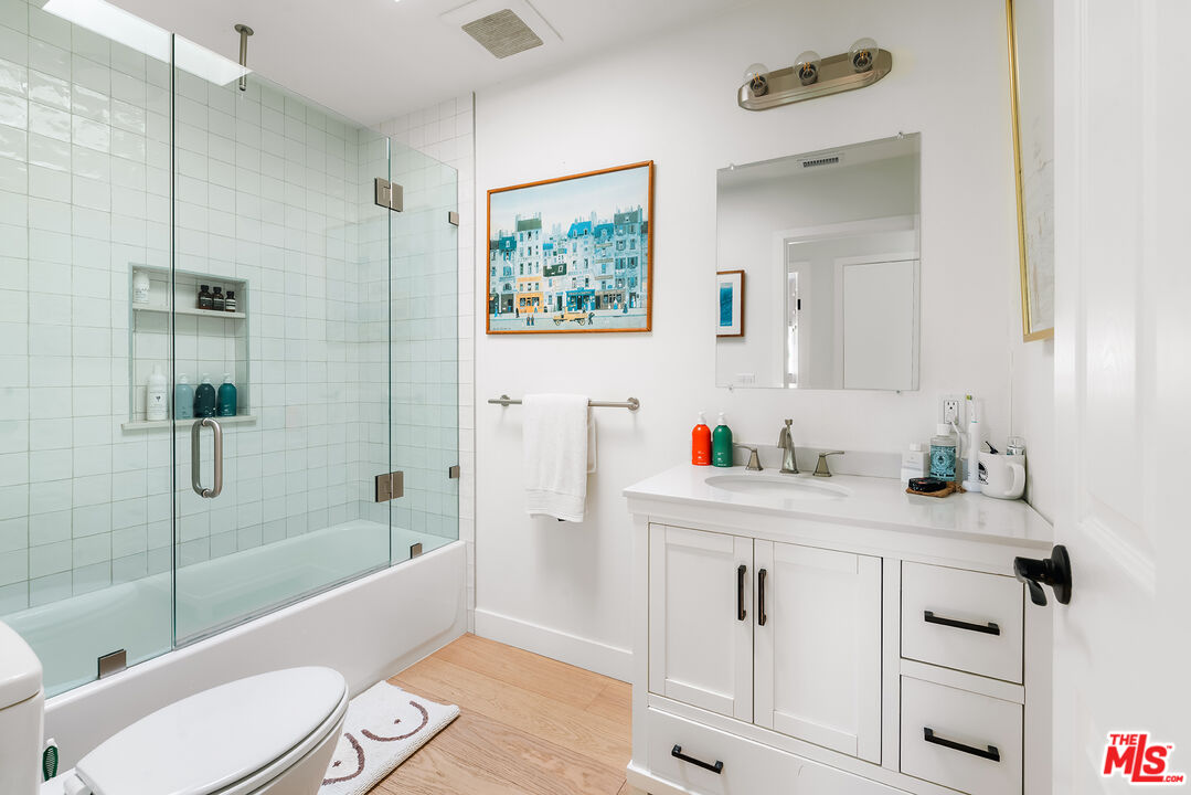 6551 Zumirez Drive Malibu, CA 90265 - Photo 18 of 36 a bathroom with a sink a toilet and bathtub