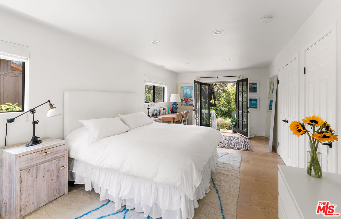 6551 Zumirez Drive Malibu, CA 90265 - Photo 19 of 36 a bed room with a bed and a couch