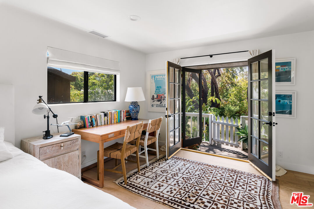 6551 Zumirez Drive Malibu, CA 90265 - Photo 21 of 36 a view of a workspace with furniture and a window