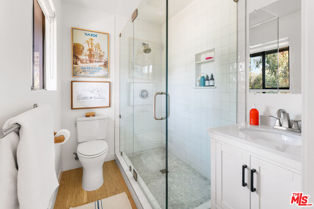 6551 Zumirez Drive Malibu, CA 90265 - Photo 23 of 36 a bathroom with a sink toilet and shower
