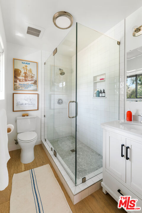 6551 Zumirez Drive Malibu, CA 90265 - Photo 24 of 36 a bathroom with a toilet and a shower