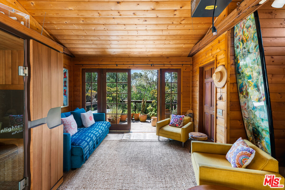 6551 Zumirez Drive Malibu, CA 90265 - Photo 25 of 36 a outdoor living space with furniture and garden view