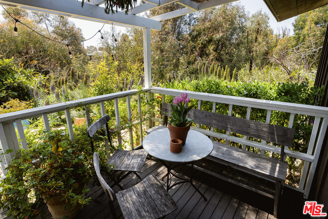 6551 Zumirez Drive Malibu, CA 90265 - Photo 28 of 36 a view of a balcony with wooden floor
