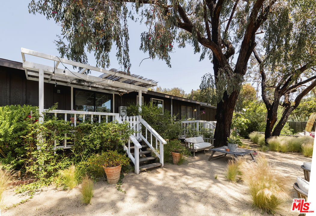 6551 Zumirez Drive Malibu, CA 90265 - Photo 35 of 36 a view of a house with a patio