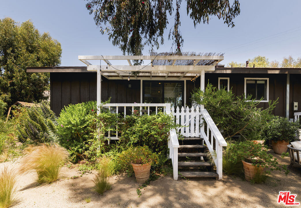 6551 Zumirez Drive Malibu, CA 90265 - Photo 36 of 36 a view of a house with a yard