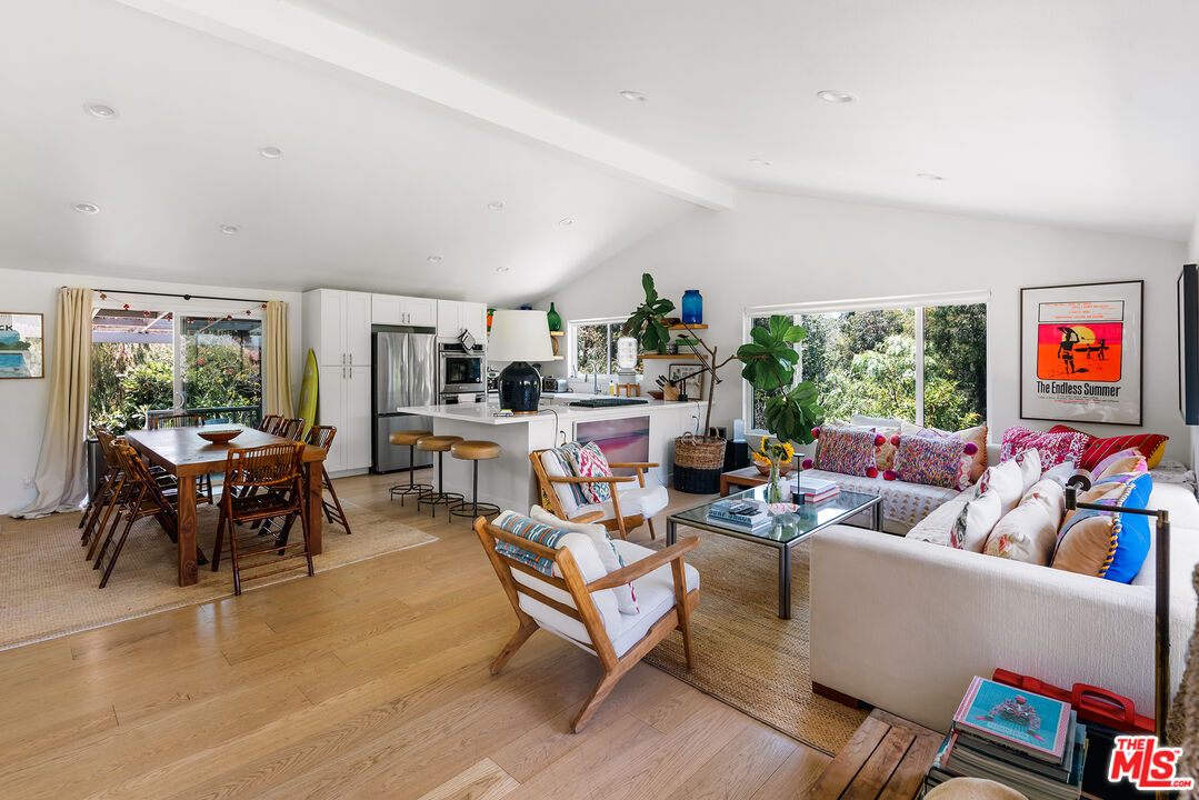 6551 Zumirez Drive Malibu, CA 90265 - Photo 6 of 36 a living room with furniture and a flat screen tv