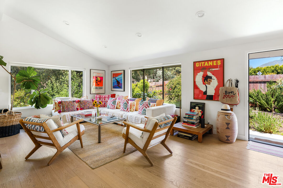 6551 Zumirez Drive Malibu, CA 90265 - Photo 10 of 36 a living room with furniture and a large window