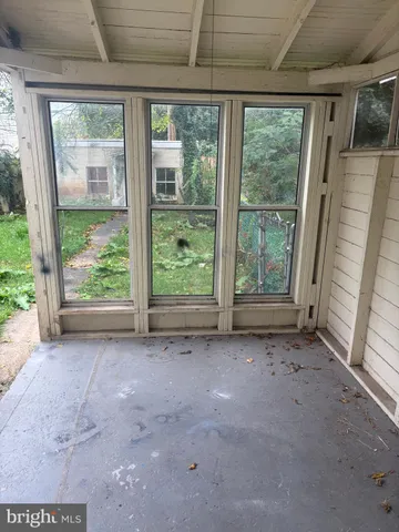 a view of a room with a large window