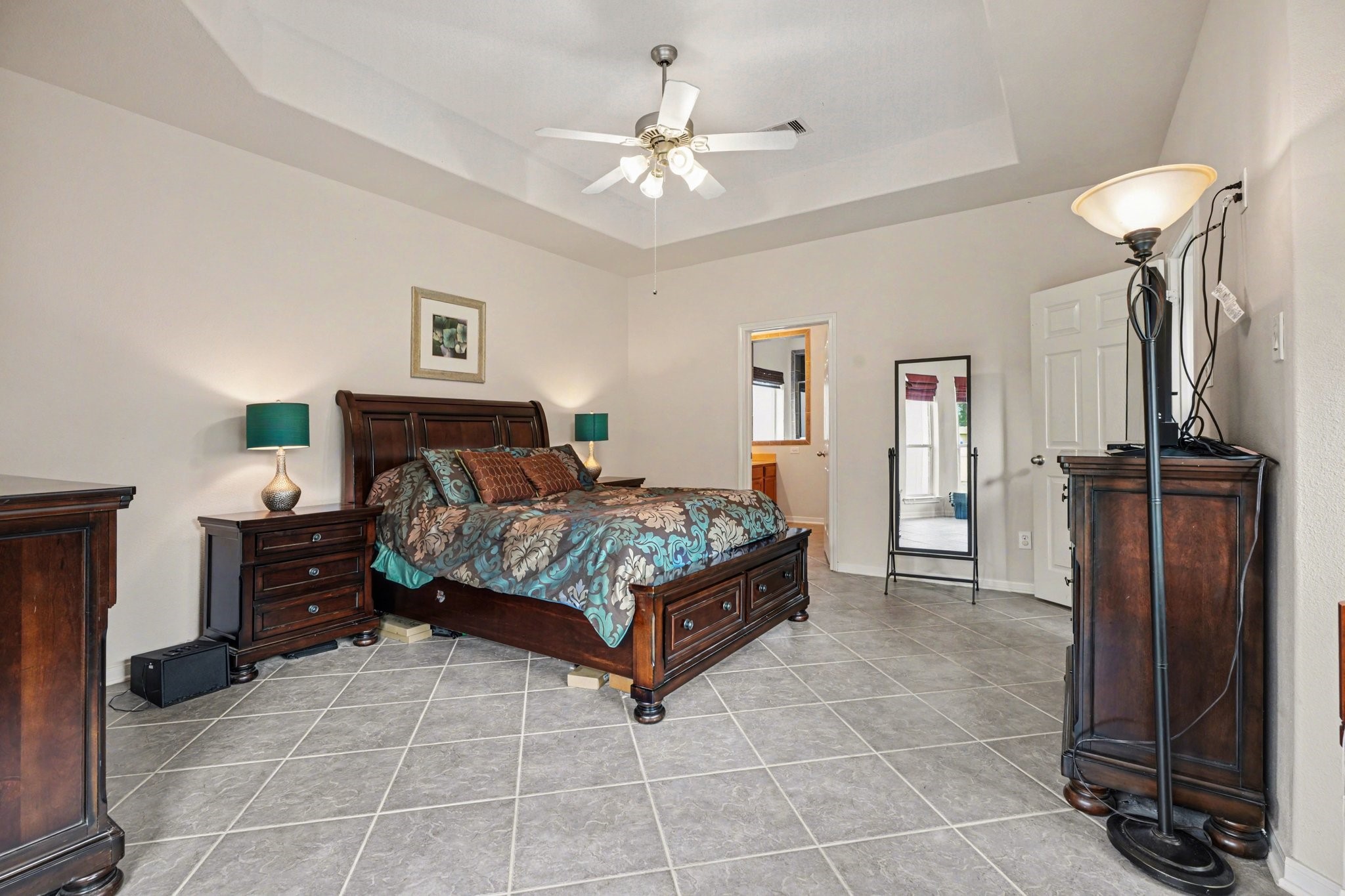 806 Dawn Ridge Way Seabrook, TX 77586 - Photo 16 of 39 a bedroom with a bed and a chandelier