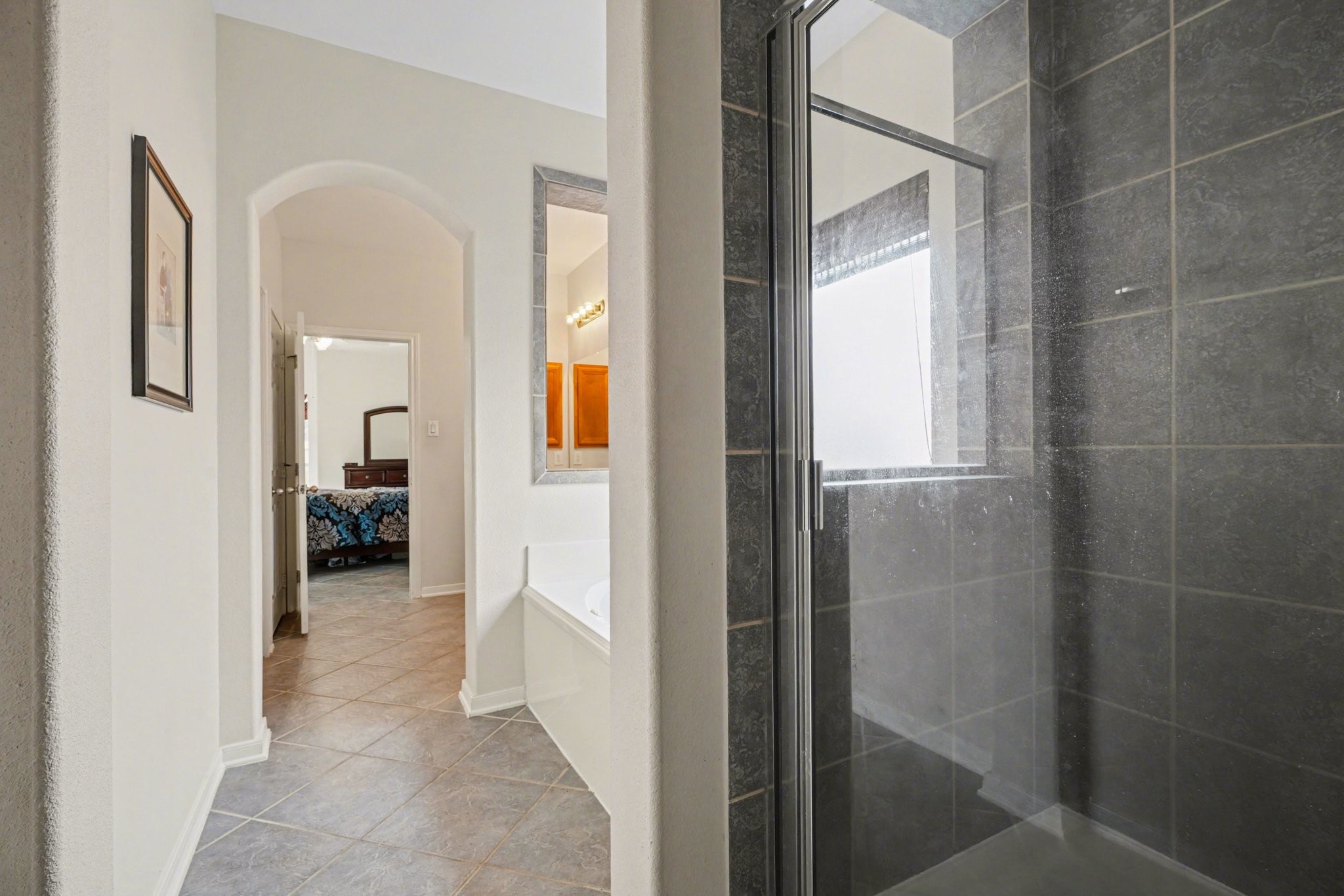 806 Dawn Ridge Way Seabrook, TX 77586 - Photo 19 of 39 a view of a hallway with wooden floor and a bathroom