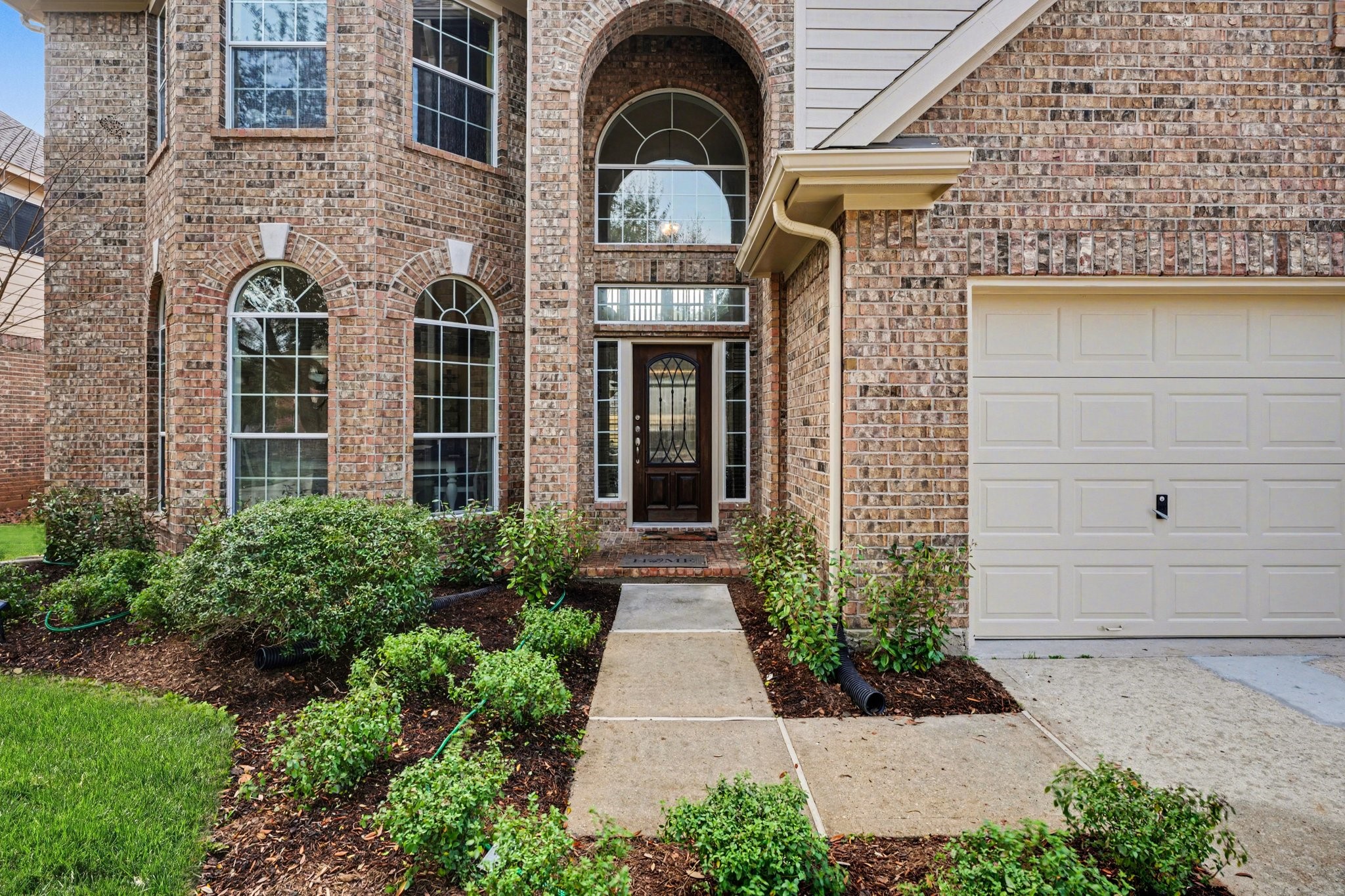 806 Dawn Ridge Way Seabrook, TX 77586 - Photo 3 of 39 a view of a brick house with potted plants