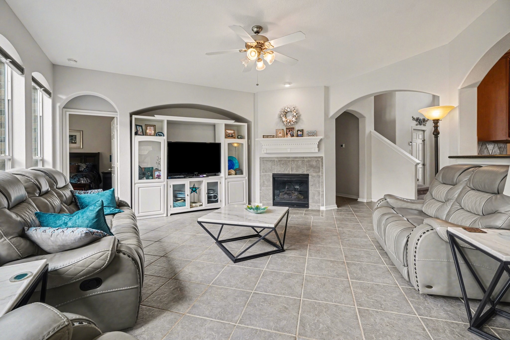 806 Dawn Ridge Way Seabrook, TX 77586 - Photo 8 of 39 a living room with furniture a flat screen tv and a fireplace