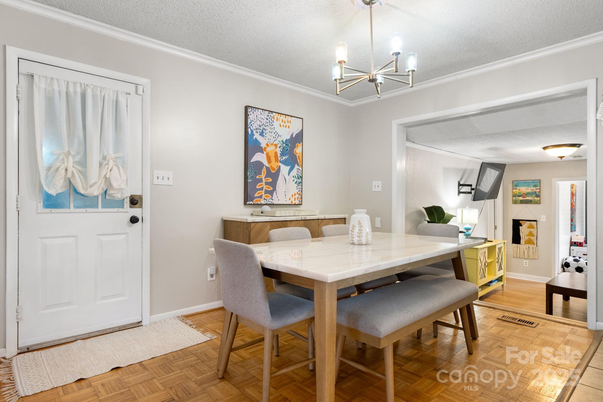 1553 Castell Lane Hickory, NC 28601 - Photo 11 of 27 a view of a dining room with furniture and chandelier