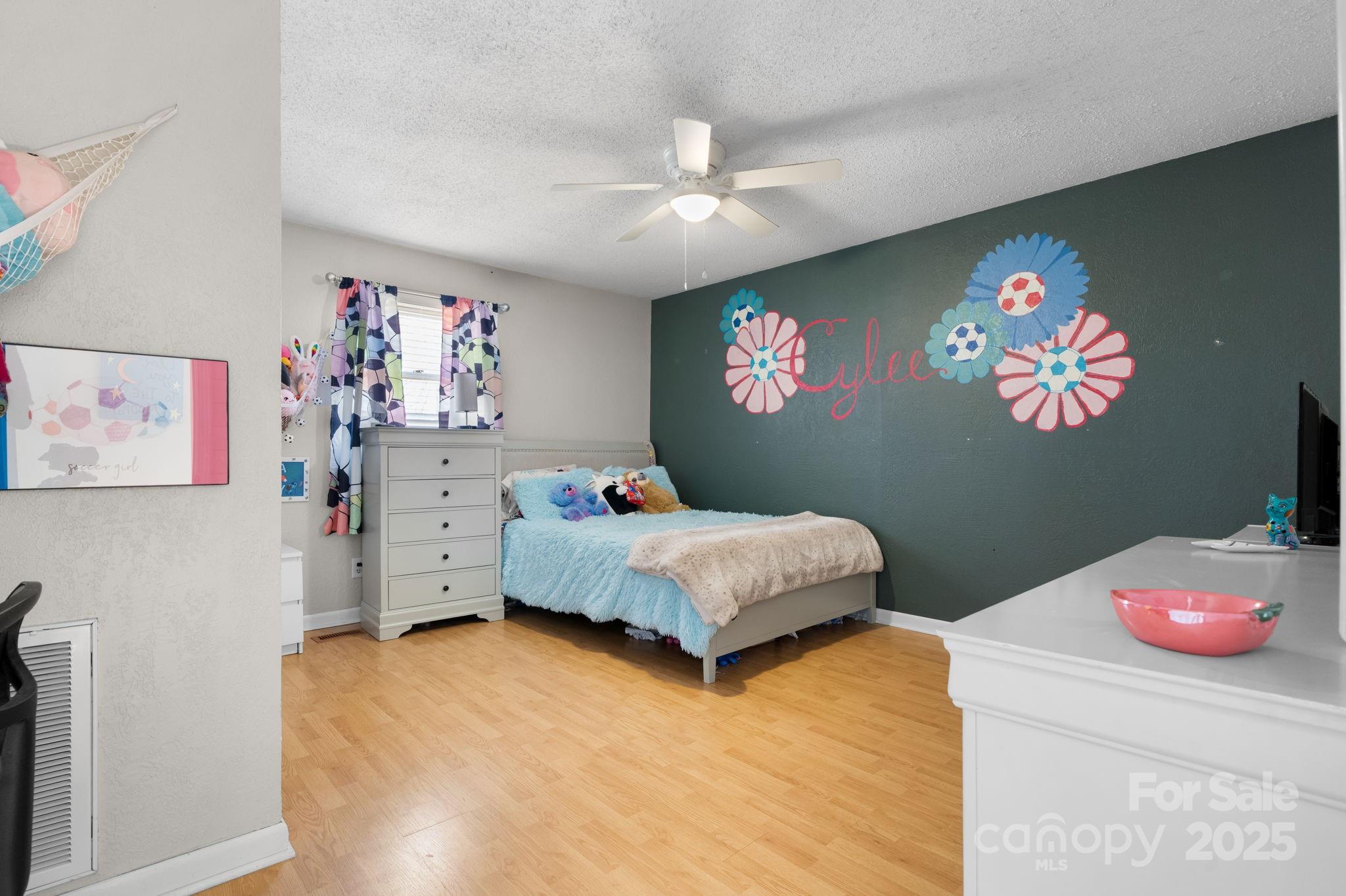 1553 Castell Lane Hickory, NC 28601 - Photo 21 of 27 a bedroom with a bed and dresser