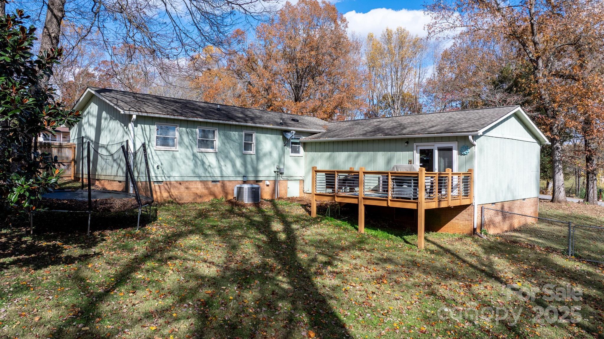 1553 Castell Lane Hickory, NC 28601 - Photo 26 of 27 a view of a house with a backyard and wooden deck