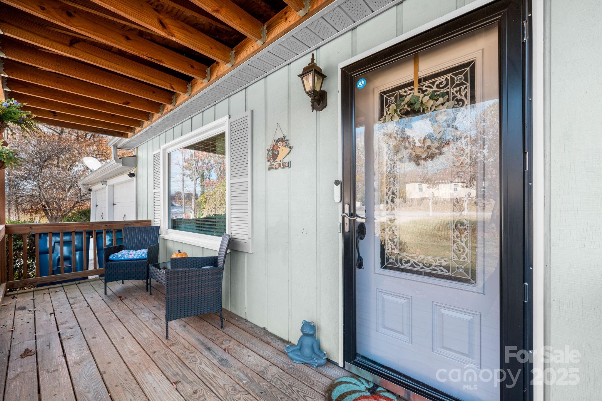 1553 Castell Lane Hickory, NC 28601 - Photo 3 of 27 a view of a balcony with furniture and wooden floor