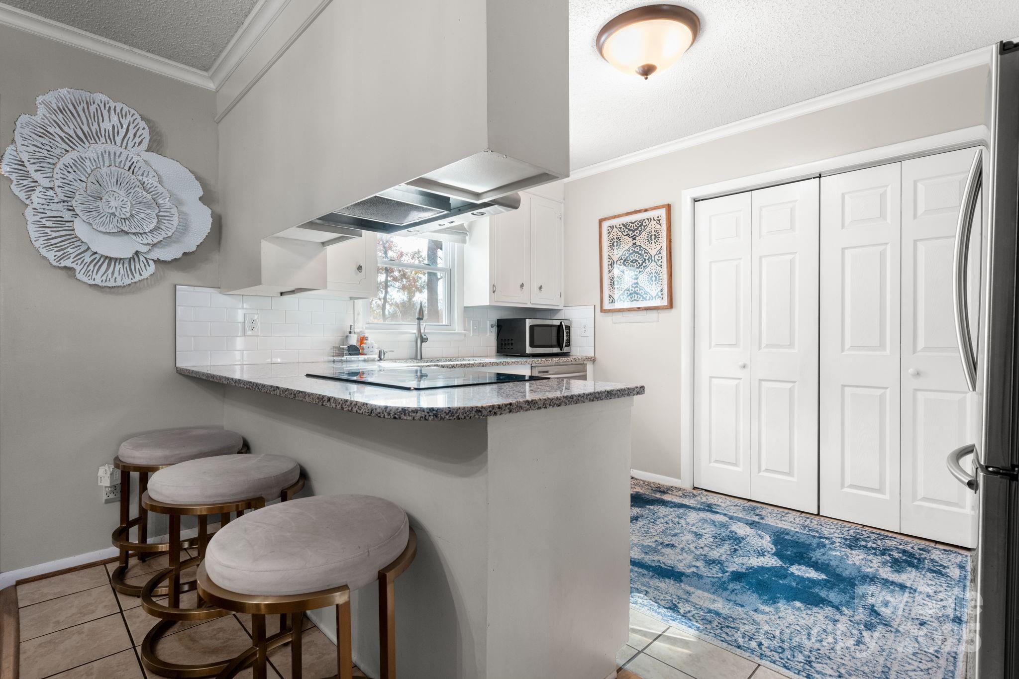 1553 Castell Lane Hickory, NC 28601 - Photo 7 of 27 a dining room with wooden floor and breakfast area